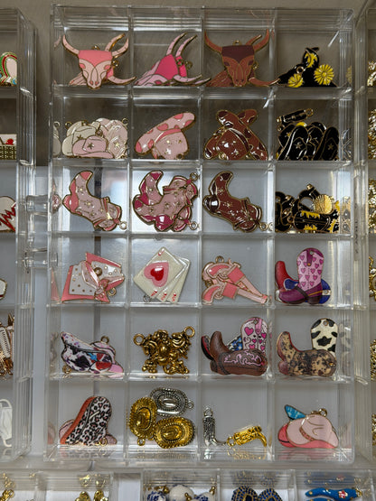 Tray of animal and heart charms in pink, cream and gold