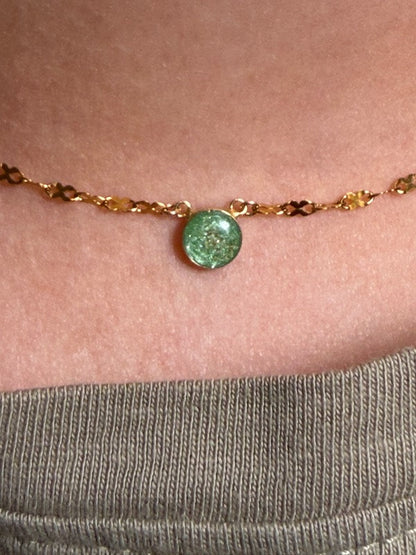 Gold permanent necklace with a green pendant